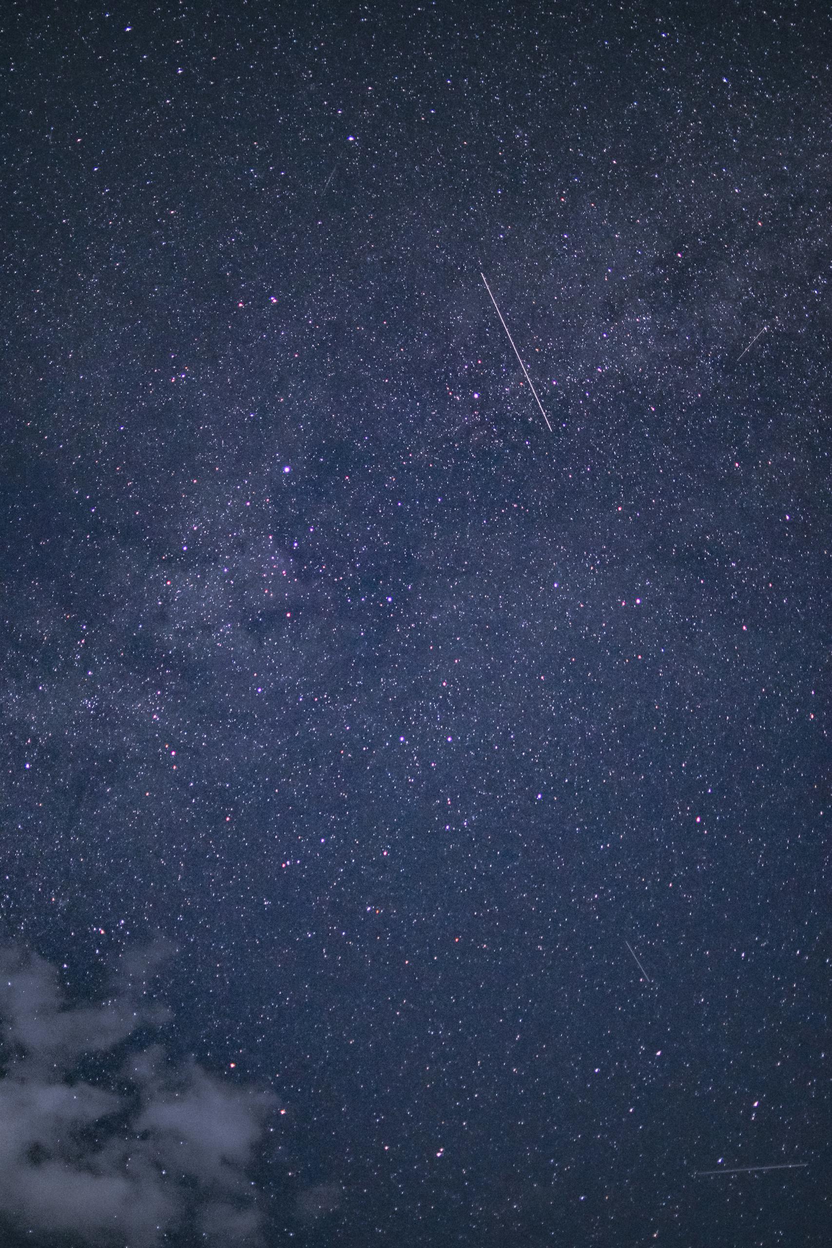 A beautiful starry night sky with visible constellations and distant galaxies, perfect for astronomy exploration.